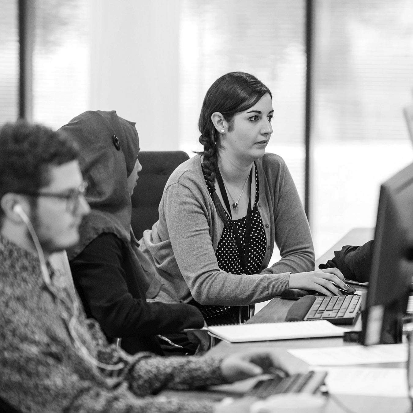 B2B market research team analysing customer insight and marketing data for evidence based strategy.