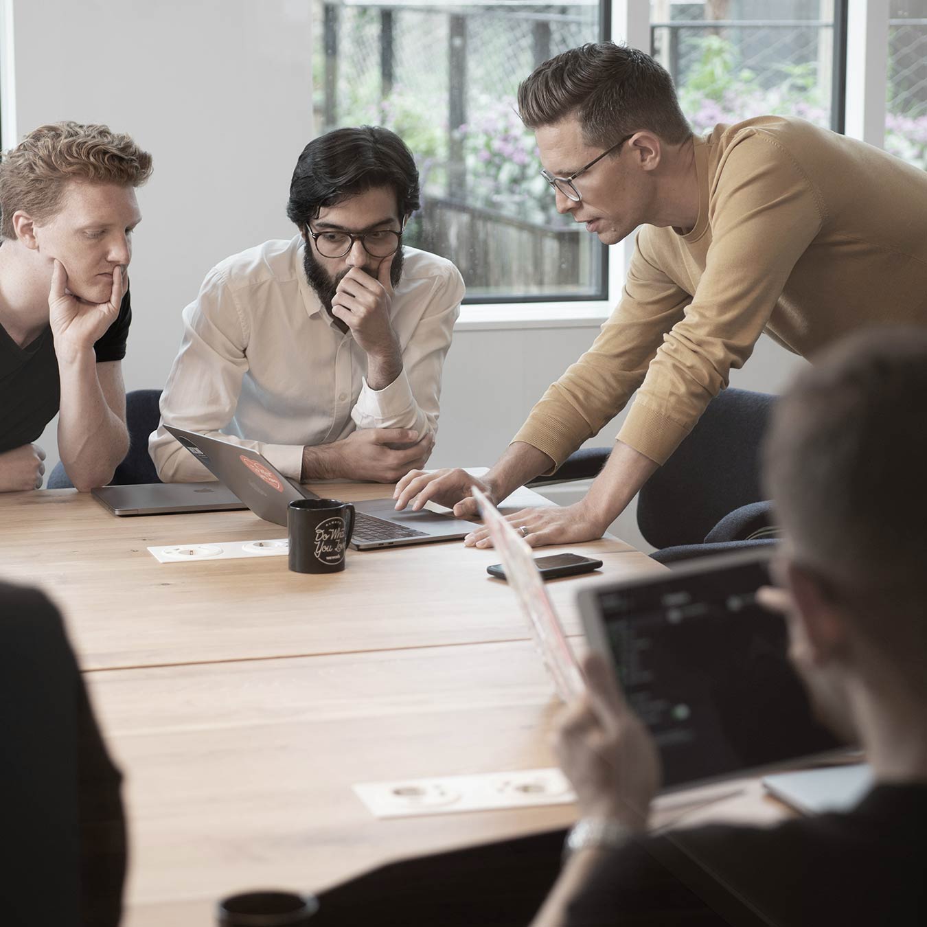 B2B marketing team collaborating on integrated wraparound marketing strategy